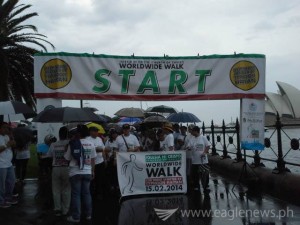 Crowds gather early despite bad weather in Sydney for INC Walk