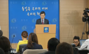 South Korean unification ministry spokesman Kim Eui-do announces the proposal on reunion of families separated since the Korea War. Courtesy Reuters/ Photo grabbed from Reuters video