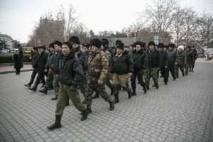 Crimean and Russian Cossacks volunteers who arrived to help local police, march in formation in the Crimean port city of Sevastopol March 2, 2014.  CREDIT: REUTERS/BAZ RATNER