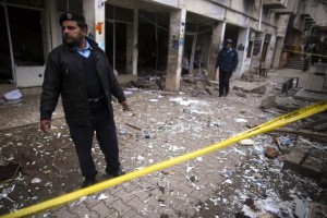 A policeman cordons off the site of a bomb attack at the district court in Islamabad March 3, 2014.