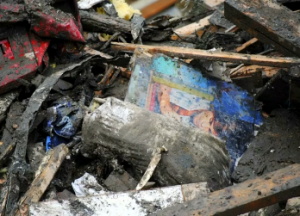 A still photograph among the debris in the deadly Washington mudslide.  Reuters