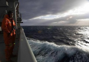 Able Seaman Marine Technician Matthew Oxley stands aboard the Australian Navy ship the HMAS Success looking for debris in the southern Indian Ocean during the search for missing Malaysian Airlines Flight MH370 in this picture released by the Australian Defence Force March 31, 2014. REUTERS/Australian Defence Force