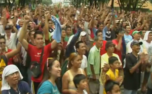 Thousands of Filipino fans cheer on after Manny Pacquiao's unanimous decision win over Timothy Bradley (Photo grabbed from Reuters video)