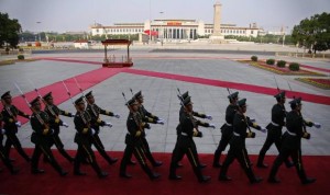 Soldiers from the honour guards of the Chinese People's Liberation Army (PLA) march in front of the Monument to the People's Heroes at Tiananmen Square, after the welcoming ceremony for Kuwait's Prime Minister Sheikh Jaber al-Mubarak al-Sabah at the Great Hall of the People, in Beijing, June 3, 2014. REUTERS/Petar Kujunzic