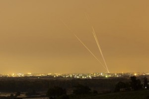 Smoke trails are seen as rockets are launched towards Israel from the northern Gaza Strip July 12, 2014.   REUTERS/Amir Cohen