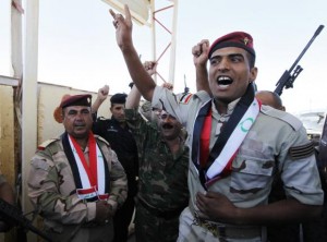 Major General Negm Abdullah Ali, army commander of the sixth division gather with Iraqi army west of Baghdad