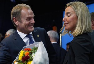 Newly elected European Council President Donald Tusk (L) and newly elected European High Representative for Foreign Affairs Minister Federica Mogherini talk together during a EU summit in Brussels August 30, 2014.  REUTERS/Yves Herman