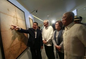 Philippines' Supreme Court associate justice Antonio Carpio (L) gestures to an ancient map on display while Philippines' Foreign Secretary Albert Del Rosario (2nd L), Justice Secretary Leila De Lima and Defense Secretary Voltaire Gazmin look on at a university in Manila September 11, 2014. Courtesy REUTERS/Romeo Ranoco