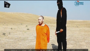 A photo grabbed from the video released by the Islamic State militant group on Tuesday (Sept.1) purporting to show the beheading of a second American hostage, journalist Steven Sotloff.  (Courtesy Reuters/photo grabbed from Reuters video)