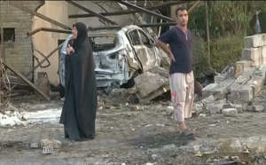 A suicide car bombing kills at least 25 people, including a member of Iraq's parliament, at a checkpoint entrance to a Shi'ite neighbourhood in Baghdad. (Photo grabbed from Reuters video/Courtesy Reuters)