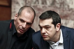 Greek Prime Minister Alexis Tsipras (R) and Finance Minister Yanis Varoufakis talk during the first round of a presidential vote at the Greek parliament in Athens, February 18, 2015. Credit: Reuters/Alkis Konstantinidis