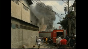 A fire inside a rubber slipper factory leaves at least 31 workers dead, while dozens more remain missing.