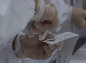 Various of laboratory technicians testing DNA samples from victims of a capsized ship on the Yangtze River.  (Photo grabbed from Reuters video/Courtesy Reuters)