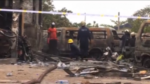 Around 90 people seeking shelter from the storm are killed in a blast at a gas station in Ghana's capital, exposing the city's poor infrastructure.  (Photo grabbed from Reuters video/Courtesy Reuters)