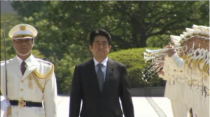 Japan's Prime Minister Shinzo Abe, inspecting troops of Japan's Self-Defence Force in 2013. (Photo grabbed from Reuters video file)