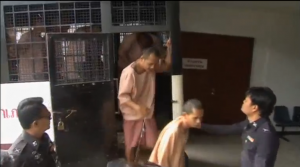 Two Myanmar men accused of murdering two British holidaymakers arrive at a court in Thailand. (Photo grabbed from Reuters video/Courtesy Reuters)