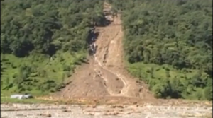 Torrential rainfall triggers a landslide in the Kaski district of Nepal, killing at least 30 people close to the nation's most popular trekking circuit, home ministry officials say. (Photo grabbed from Reuters video)