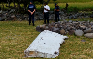 Still photographs showing a large piece of plane debris found on the beach in Saint-Andre, on the French Indian Ocean island of La Reunion on Wednesday (July 29). Investigations are underway to determine whether it came from Malaysia Airlines Flight MH370, which vanished last year in one of the biggest mysteries in aviation history. (Photo courtesy Reuters)