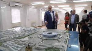 Dmitry Svatkovsky, gold medallist in modern pentathlon at the 2000 Sydney Olympics and current Deputy Governor of the Nizhny Novgorod region, showing journalists a model of the new soccer stadium.  (Photo grabbed from Reuters video/Courtesy Reuters)