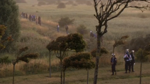 French riot police move migrants away from motorway in Calais.  (Photo grabbed from Reuters video)