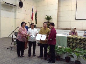 Mr. Noe Pobadora, Coordinator of the AB Foreign Service at New Era University receives a certificate of appreciation