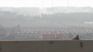 Hundreds of damaged containers at the Tianjin port in China. The explosions at the port, the world's 10th largest, were so big they were seen by satellites in space and registered on earthquake sensors.  (Courtesy Reuters/Photo grabbed from Reuters video)