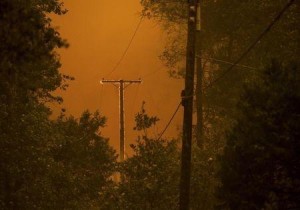 A power line burns as the "Butte Fire" rages along East Murray Creek Road in Mountain Ranch, California, September 11, 2015. REUTERS/Noah Berger