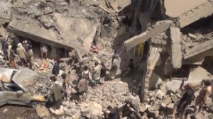 Air strikes on Yemeni homes in the capital Sanaa kills 20 people, 18 from the same extended family, including women and children, residents and witnesses say. (Photo captured from Reuters video)