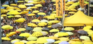 About 1,000 demonstrators rally in Hong Kong amid tight security to mark the first anniversary of the pro-democracy protests. (Courtesy Reuters/Photo grabbed from Reuters video)