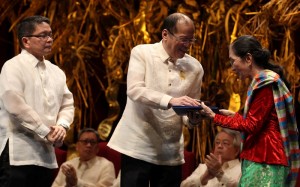 President Benigno S. Aquino III with RMAF chairman Fr. Jose Ramon Villarin, S.J. presents the medal and certificate to Ligaya Fernando-Amilbangsa from the Philippines as one of the 2015 Ramon Magsaysay awardees during the presentation ceremonies at the Main Theater of the Cultural Center of the Philippines in Pasay Cityon Monday (August 31, 2015). Established in 1957, the Ramon Magsaysay Awards is Asia's highest honor and is widely regarded as the region's equivalent of the Nobel Prize. (Photo by Robert Viñas / Malacañang Photo Bureau)