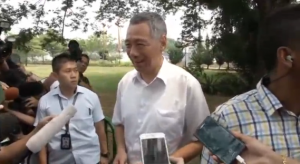 Singapore's Prime Minister Lee Hsien Loong casts his vote in a general election bound to be won by the ruling party.  (Courtesy Reuters/Photo grabbed from Reuters video)