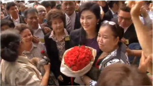 Ousted Thai PM Yingluck Shinawatra was greeted by her supporters before she enters the Thai Supreme Court to face her corruption trial.