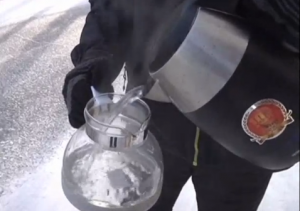 Man pouring hot water into glass pot.  (Photo grabbed from CCTV video)