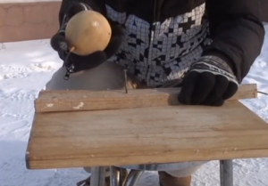 This icy pear is used as a hammer because of the extremely cold weather in China.  (Photo grabbed from CCTV/ Courtesy CCTV)