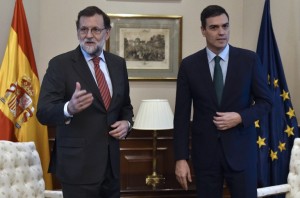 Spain's acting Prime Minister Mariano Rajoy and Spanish Socialist Party (PSOE) leader Pedro Sanchez (R) stand before a meeting at the Spanish parliament in Madrid on Feb. 12.  (AFP/ Gerard Julien)