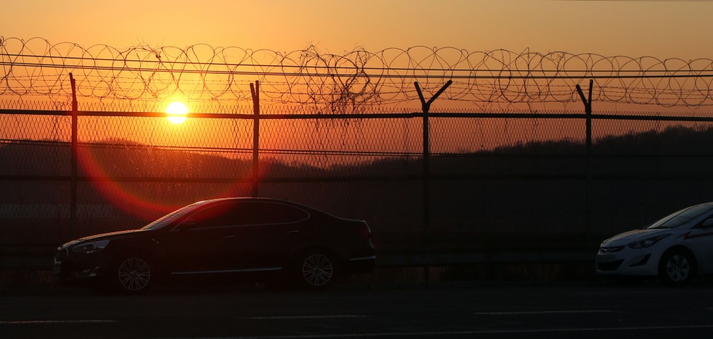 Vehicles cross the Tongil bridge leading away from the Kaesong joint industrial area and the Demilitarized Zone (DMZ) between the two Koreas in Paju on February 10, 2016. South Korea said on February 10 it would suspend operations at the Kaesong joint industrial complex in North Korea to punish Pyongyang for its latest rocket launch and nuclear test. REPUBLIC OF KOREA OUT - NO ARCHIVES - RESTRICTED TO SUBSCRIPTION USE -- AFP PHOTO / YONHAP / AFP / YONHAP / YONHAP