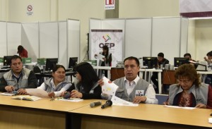 Members of the electoral tribunal count votes at a count center after a referendum through which Bolivian President Evo Morales sought a fourth term and potentially extend his presidency until 2025, in La Paz on February 23, 2016. Morales stood firm Tuesday in the face of likely defeat in his bid to seek a fourth term, refusing to concede until final referendum results trickle in. AFP PHOTO/Aizar Raldes / AFP / AIZAR RALDES