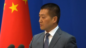 Chinese Foreign Ministry spokesman Lu Kang addresses a daily news briefing.  China accuses the United States of seeking maritime "hegemony" in the name of freedom of navigation after a U.S. Navy destroyer sailed within 12 nautical miles of a disputed island in the South China Sea.  (Courtesy Reuters/Photo grabbed from Reuters video)