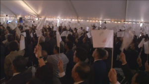 Iglesia ni Cristo members wave flaglets in support of the INC Executive Minister Brother Eduardo V. Manalo. Photo grabbed from video. (Eagle News Service)