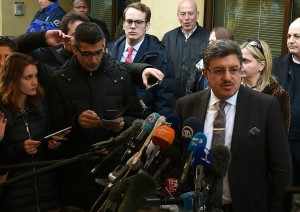 High Negotiations Committee (HNC) spokesman Salem al-Meslet (R) addresses the media during a press conference on the eve of the second round of Syrian peace talks in Geneva on March 13, 2016. A new round of indirect peace talks beginning on March 14 will see Syria's government and opposition engage for the first time in concrete discussions on the future of the war-torn country. / AFP / PHILIPPE DESMAZES