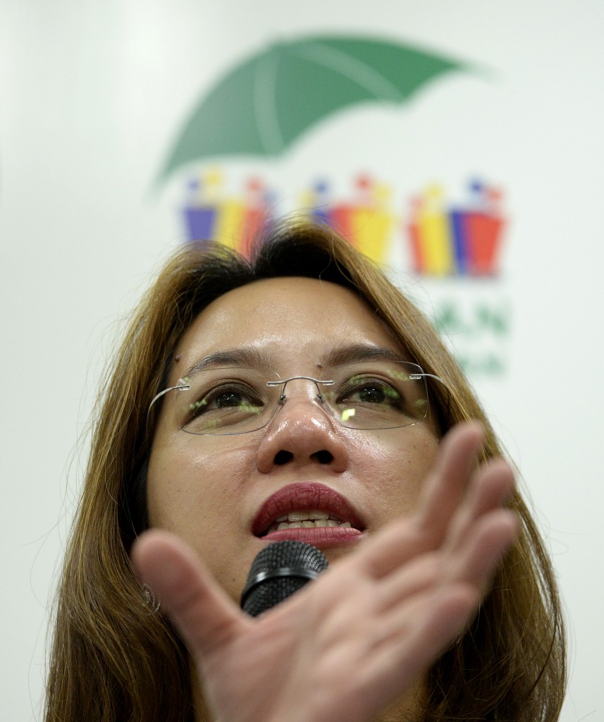 Department of Health (DOH) secretary Janette Garin gestures during a press conference on the Zika Virus at the DOH headquarters in Manila on March 14, 2016.  The DOH announced that it will strengthen its monitoring against the Zika Virus and called all pregnant women to be more careful against mosquito bites during the day. / AFP / NOEL CELIS