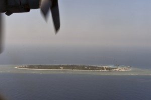 This aerial image taken from a C-130 transport plane shows a general view of Taiping island during a visit by journalists to the island, in the Spratlys chain in the South China Sea on March 23, 2016. Taiwan on March 23 gave its first ever international press tour of a disputed island in the South China Sea to boost its claim, less than two months after a visit by its leader sparked protests from rival claimants.  / AFP / SAM YEH