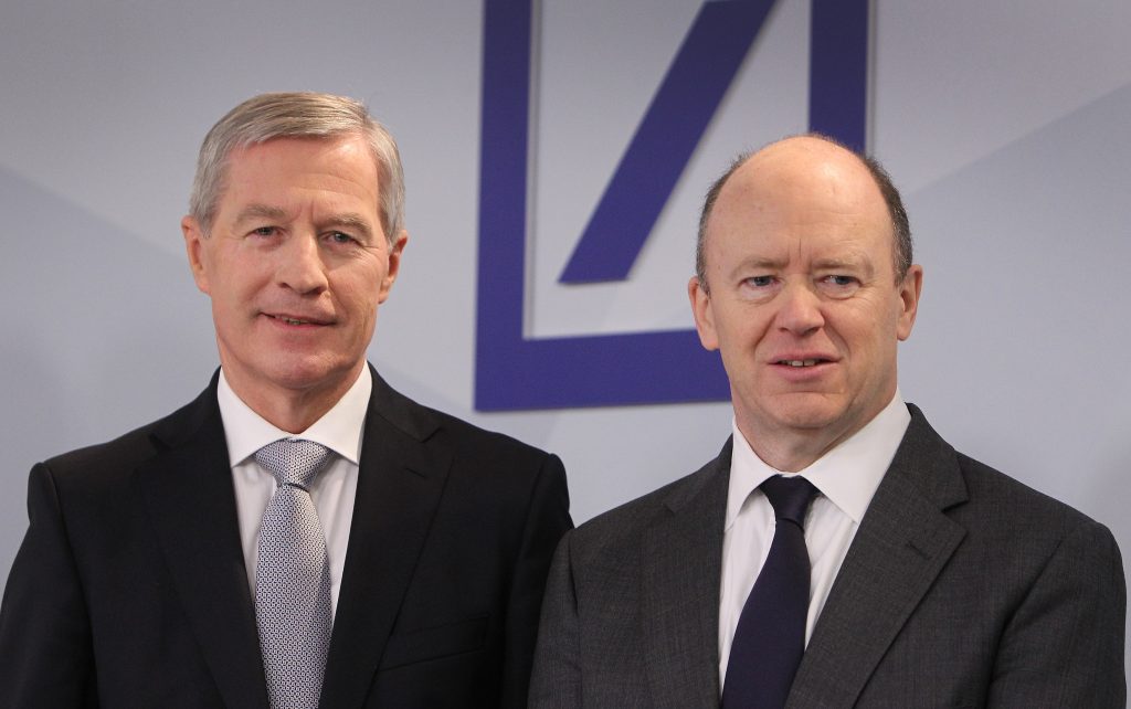 Juergen Fitschen(L) and John Cryan, Co-CEO of the Deutsche Bank pose for a picture prior to the company's annual press conference in Frankfurt/Main, Germany, on January 28, 2016. Deutsche Bank AG on Thursday reported a 6,8 billion Euro (7,2 billion dollars) loss. / AFP PHOTO / DANIEL ROLAND