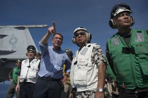 In this image released by the US Department of Defense, US Secretary of Defense and Philippine Secretary of National Defense Voltaire Gazmin (2nd R) tour the USS Stennis aircraft carrier as it sails the South China Sea April 15, 2016. Carter is visiting the Philippines to solidify the rebalance to the Asia-Pacific region. / AFP PHOTO / Digital / Senior Master Sgt. Adrian Cadiz / 