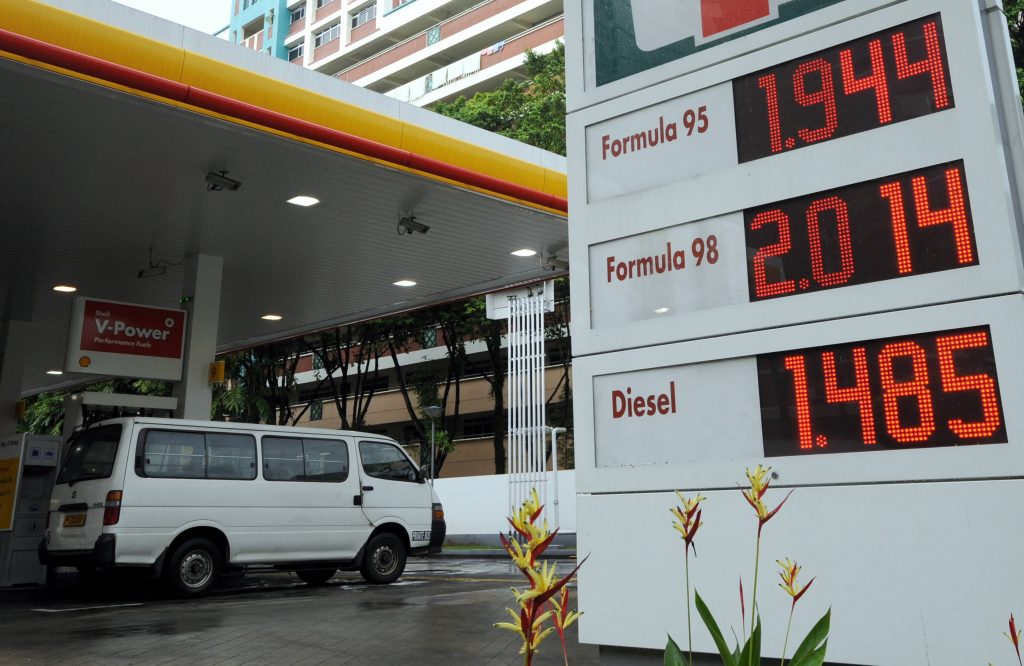 Discounted fuel prices listed at the entrance of a petrol station in Singapore on March 12, 2008. Oil prices were close to 109 dollars in Asian trade, underpinned by the US dollar's dive to a new low against the euro and supply concerns, dealers said. AFP PHOTO/ROSLAN RAHMAN / AFP PHOTO / ROSLAN RAHMAN