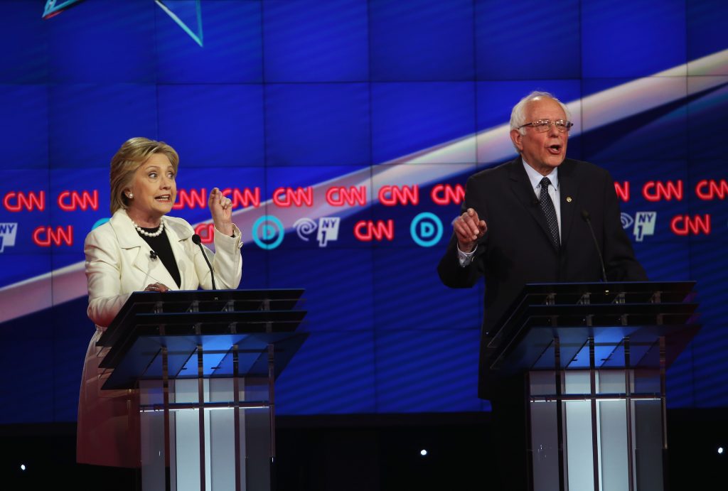 NEW YORK, NY - APRIL 14: Democratic Presidential candidates Hillary Clinton and Sen. Bernie Sanders (D-VT) debate during the CNN Democratic Presidential Primary Debate at the Duggal Greenhouse in the Brooklyn Navy Yard on April 14, 2016 in New York City. The candidates are debating ahead of the New York primary to be held April 19. Justin Sullivan/Getty Images/AFP