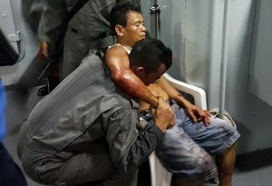 (File photo) This undated handout picture release on April 16, 2016 by the Malaysian Maritime Enforcement Agency shows a member of Malaysian Maritime Enforcement Force rescuing an Indonesian sailor after being shot during a kidnapping at the east coast of Malaysia's Sabah state in Lahad Datu.   / AFP PHOTO / Malaysian Maritime Enforcement A / MALAYSIAN MARITIME ENFORCEMENT A