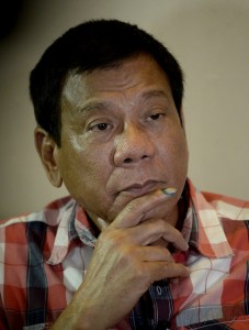 Philippines Presidential frontrunner and Davao City Mayor Rodrigo Duterte listens to questions from the press at a hotel in Davao City on the southern island of Mindanao on May 9, 2016. Anti-establishment firebrand Rodrigo Duterte was heading for a huge win in the Philippine presidential elections, according to a poll monitor, after an incendiary campaign dominated by his profanity-laced threats to kill criminals. / AFP PHOTO / NOEL CELIS