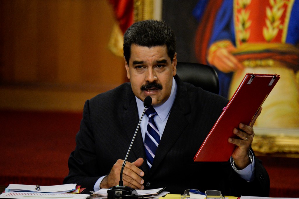 Venezuelan President Nicolas Maduro speaks during a press conference at the Miraflores presidential palace in Caracas on May 17, 2016. The army in crisis-hit Venezuela has to choose whether it is "with the constitution or with (President Nicolas) Maduro," opposition leader Henrique Capriles said Tuesday. / AFP PHOTO / FEDERICO PARRA