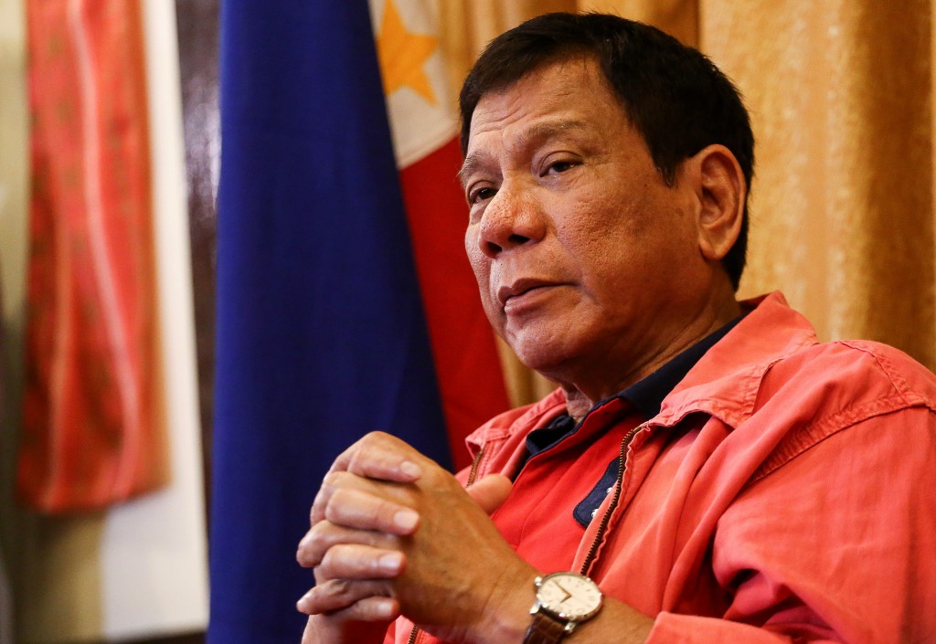 Philippines' president-elect Rodrigo Duterte speaks during a press conference in Davao City, in southern island of Mindanao on May 26, 2016. Explosive incoming Philippine president Rodrigo Duterte has launched a series of obscenity-filled attacks on the Catholic Church, branding local bishops corrupt "sons of whores" who are to be blamed for the nation's fast-growing population. / AFP PHOTO / MANMAN DEJETO